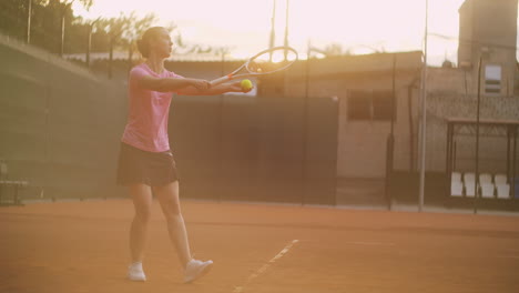 Slow-motion:-A-female-tennis-player-strikes-the-ball-while-serving.-tennis-supply